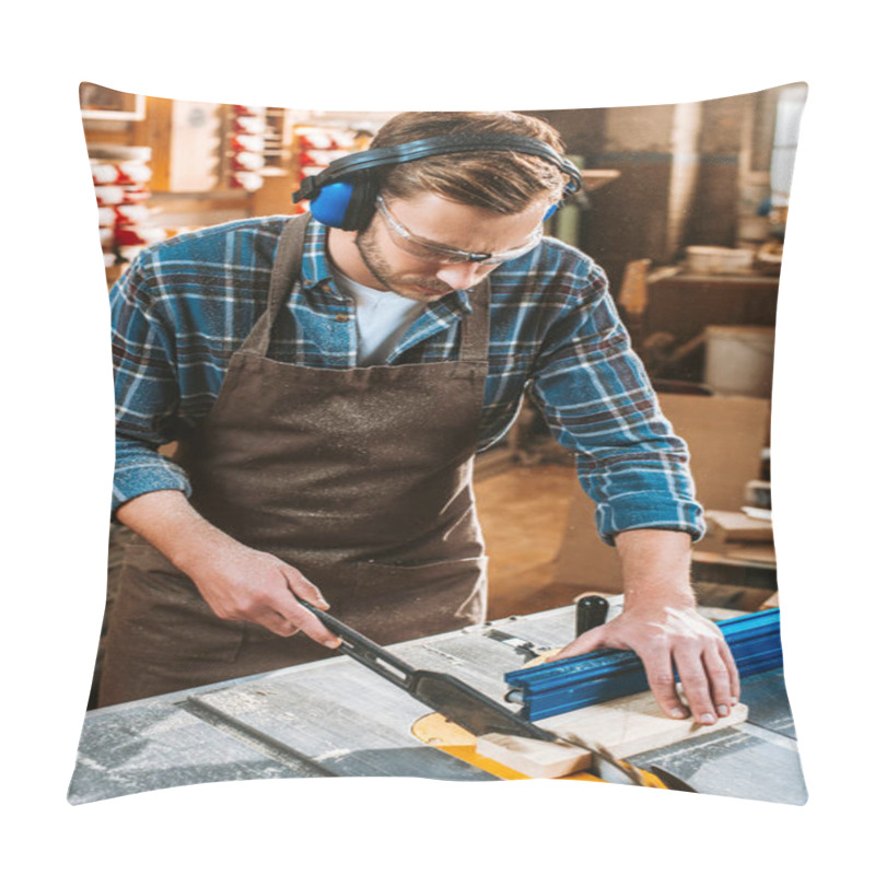 Personality  Bearded Woodworker In Protective Headphones And Apron Holding Plank Near Circular Saw Pillow Covers