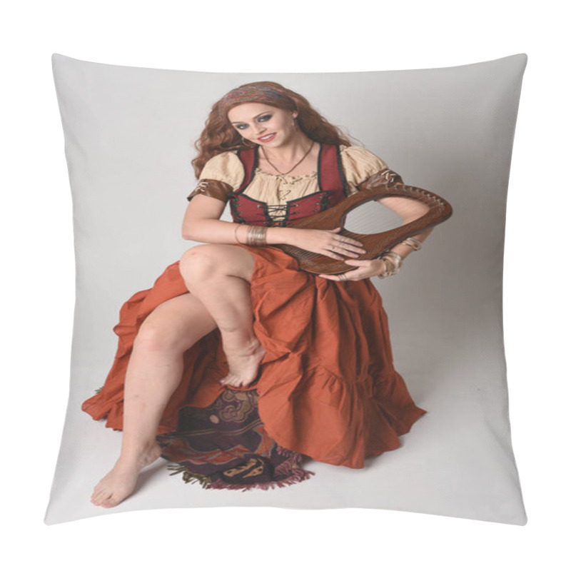 Personality  Full Length Portrait Of Beautiful Red Haired Woman Wearing A Medieval Maiden, Fortune Teller Costume.  Sitting Pose, Holding Musical Lyre Instrument. Isolated On Studio Background. Pillow Covers