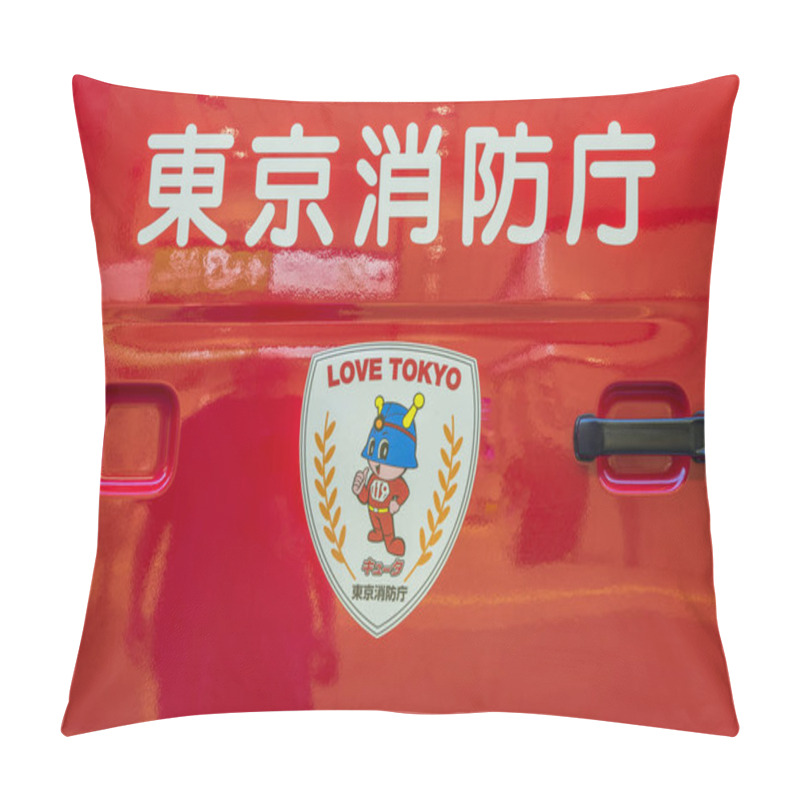 Personality  TOKYO, JAPAN - August 18 2018: View Of A Red Japanese Fire Truck Door Handle With Ideograms Signifying Tokyo Firefighters And Firemen's Mascot With The Emergency Number 119 On The Chest And The LOVE TOKYO Slogan On An Escutcheon Sticker. Pillow Covers