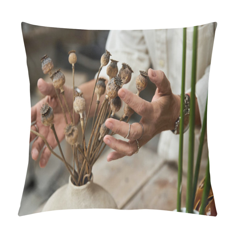 Personality  A Mature Woman Delicately Arranges Dried Poppy Flowers In A Rustic Vase While Focusing Intently. Pillow Covers