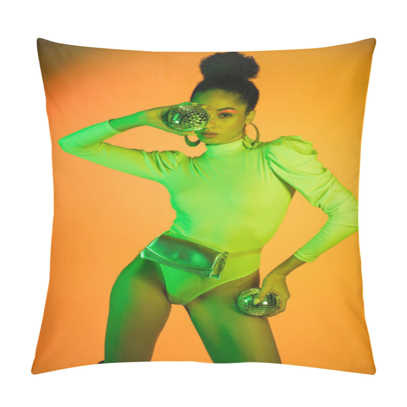 Personality  Fashionable African American Woman In Neon Bodysuit Holding Disco Balls On Orange Background  Pillow Covers