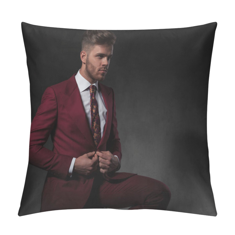 Personality  Seated Man Buttons His Red Suit While Looking To Side On Grey Wallpaper Background Pillow Covers