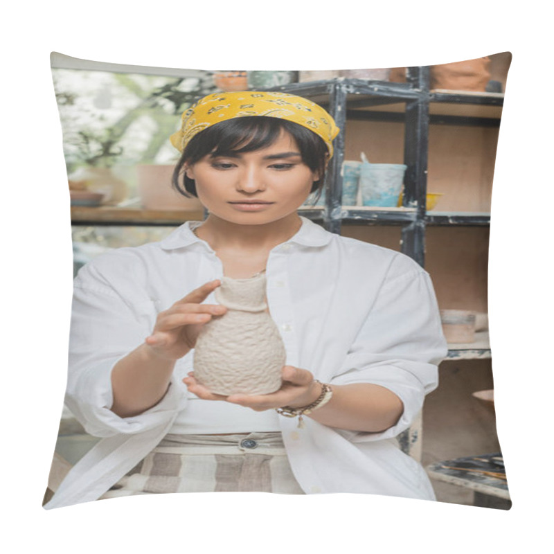 Personality  Portrait Of Young Asian Female Potter In Headscarf And Workwear Holding Clay Sculpture And Working In Blurred Ceramic Workshop, Craftsmanship In Pottery Making Pillow Covers