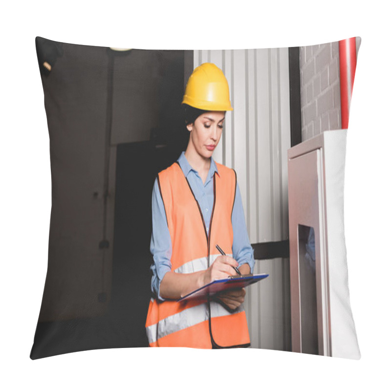 Personality  Attractive Firefighter In Helmet Standing Near Fire Panel And Writing On Clipboard Pillow Covers