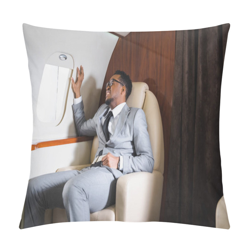 Personality  Nervous African American Businessman Holding Safety Belt And Suffering From Panic Attack During Flight On Private Plane Pillow Covers