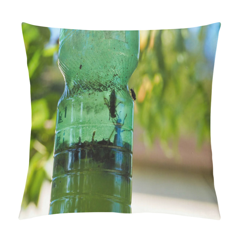 Personality  A Close-up View Of A Green Bottle Used As A Homemade Flytrap, With Trapped Insects Visible Inside, Outdoors On A Sunny Day With Blurred Background Foliage. Pillow Covers