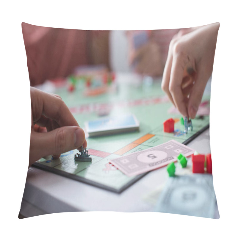 Personality  KYIV, UKRAINE - JANUARY 27, 2020: Cropped View Of Man And Woman Holding Toy Figurines While Playing Monopoly Game Pillow Covers