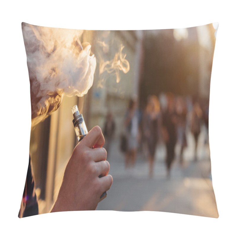 Personality  Man Using Vape Or Electronic Cigarette Against The Background Of Pillow Covers