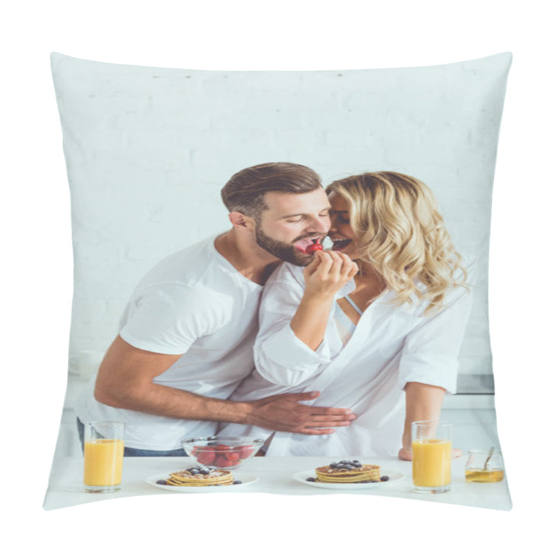 Personality  Happy Young Woman Feeding Boyfriend With Strawberry While Standing At Kitchen Table With Served Breakfast Pillow Covers