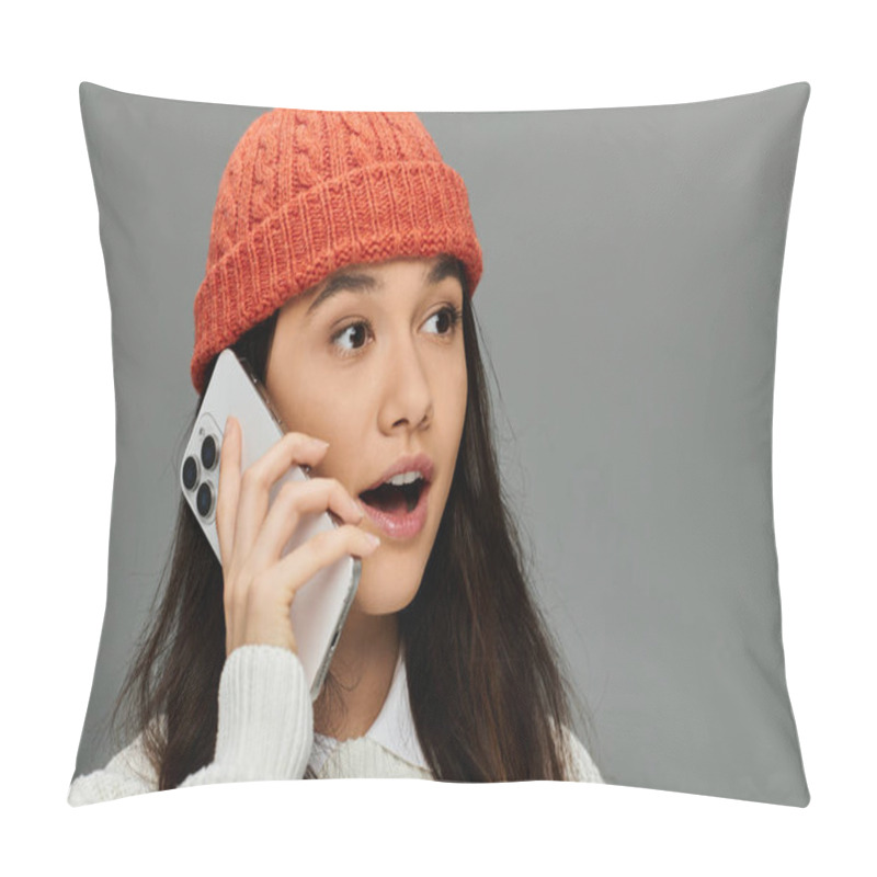 Personality  A Stylish Young Woman Wearing A Cozy Hat Reacts With Excitement During A Phone Call. Pillow Covers