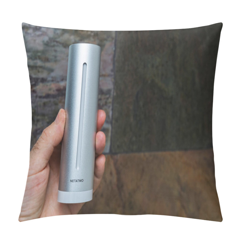 Personality  Paris, France - Nov 16, 2020: Close-up Of A Hand Holding The Sleek Silver Netatmo Indoor Weather Station Against A Textured Background, Showcasing Its Modern Design And Advanced Weather-monitoring Pillow Covers