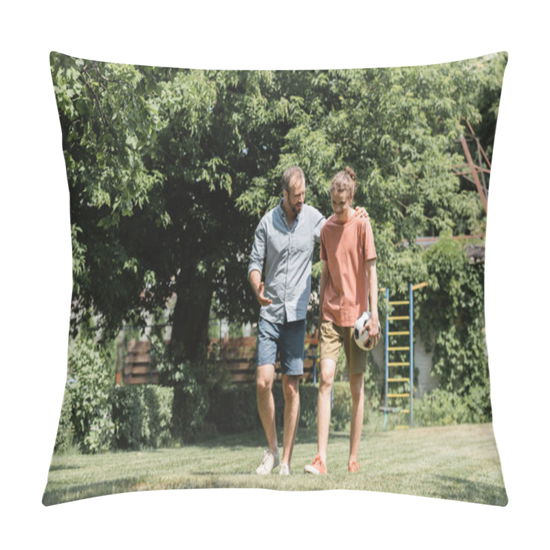 Personality  Bearded Father Hugging Son Holding Football While Walking In Green Field  Pillow Covers