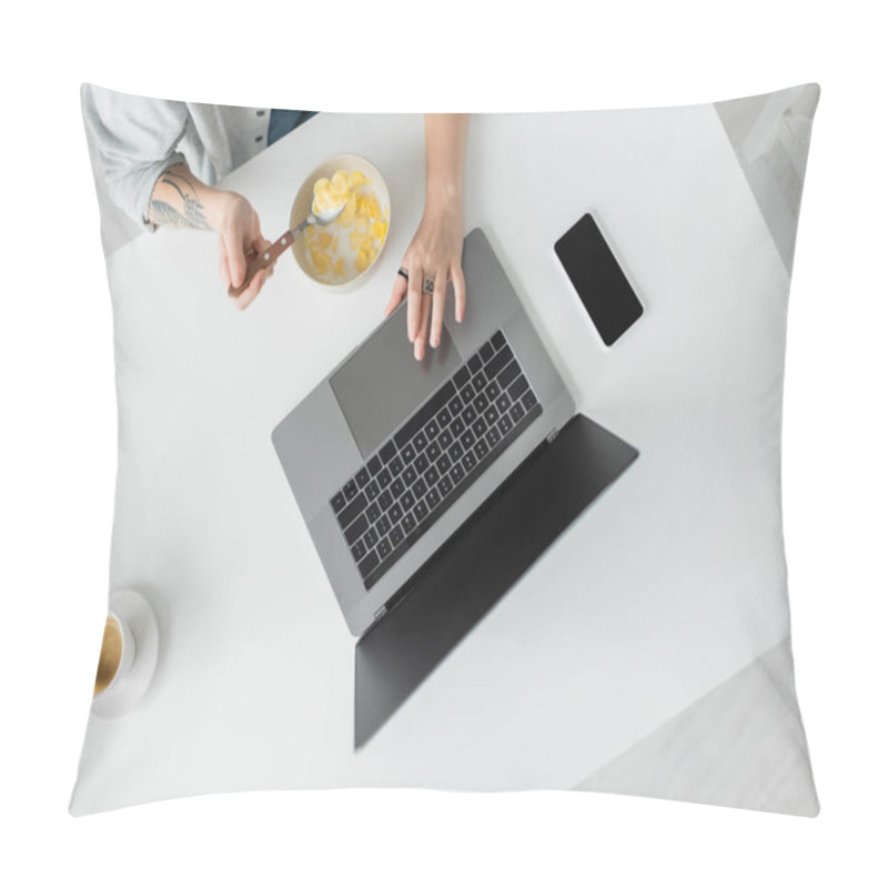 Personality  Top View Of Young Woman With Tattoo On Hand Eating Cornflakes For Breakfast While Using Laptop Near Smartphone With Blank Screen And Cup Of Coffee On Table In Modern Kitchen, Freelancer, Cropped Shot Pillow Covers