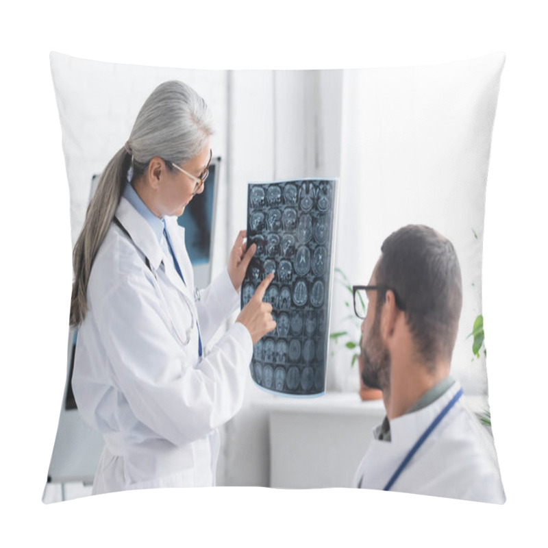 Personality  Mature Asian Doctor Pointing At Head Mri Scan To Colleague On Blurred Foreground Pillow Covers