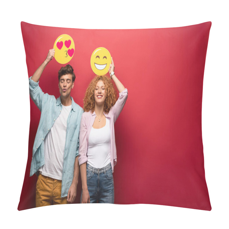 Personality  KYIV, UKRAINE - SEPTEMBER 26, 2019: Happy Couple Holding Smiling And Kissing Emoji Signs, On Red Pillow Covers