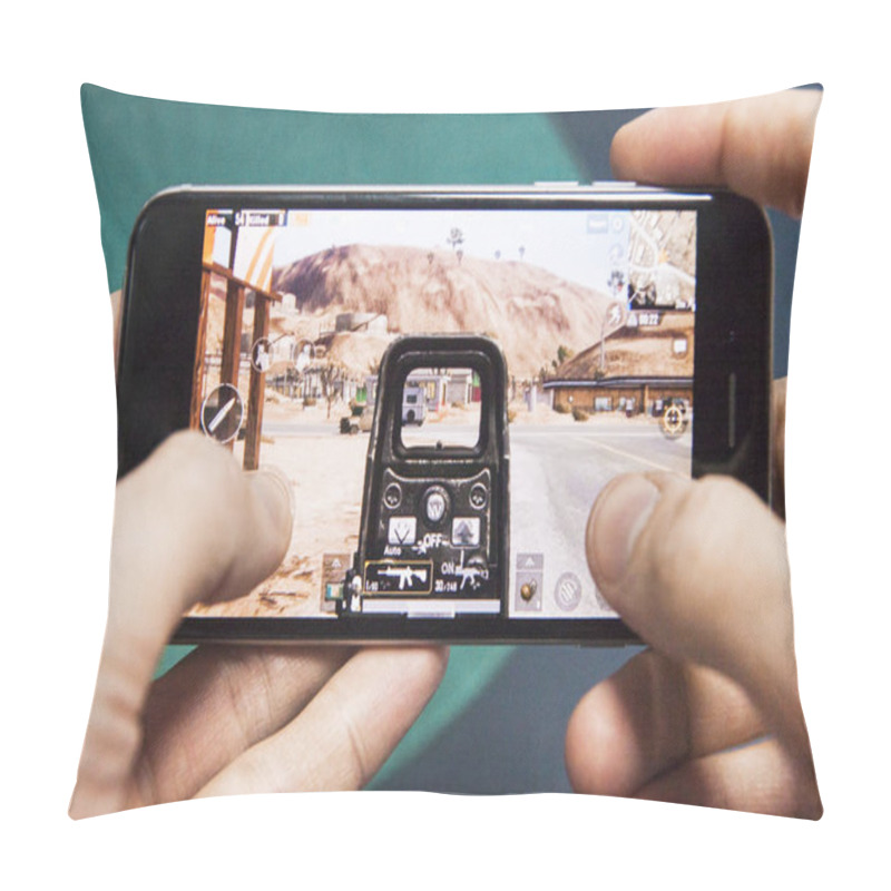 Personality  Los Angeles, California, USA - 17 December 2018: Hands Holding A Smartphone With PUBG FPS Game Pillow Covers