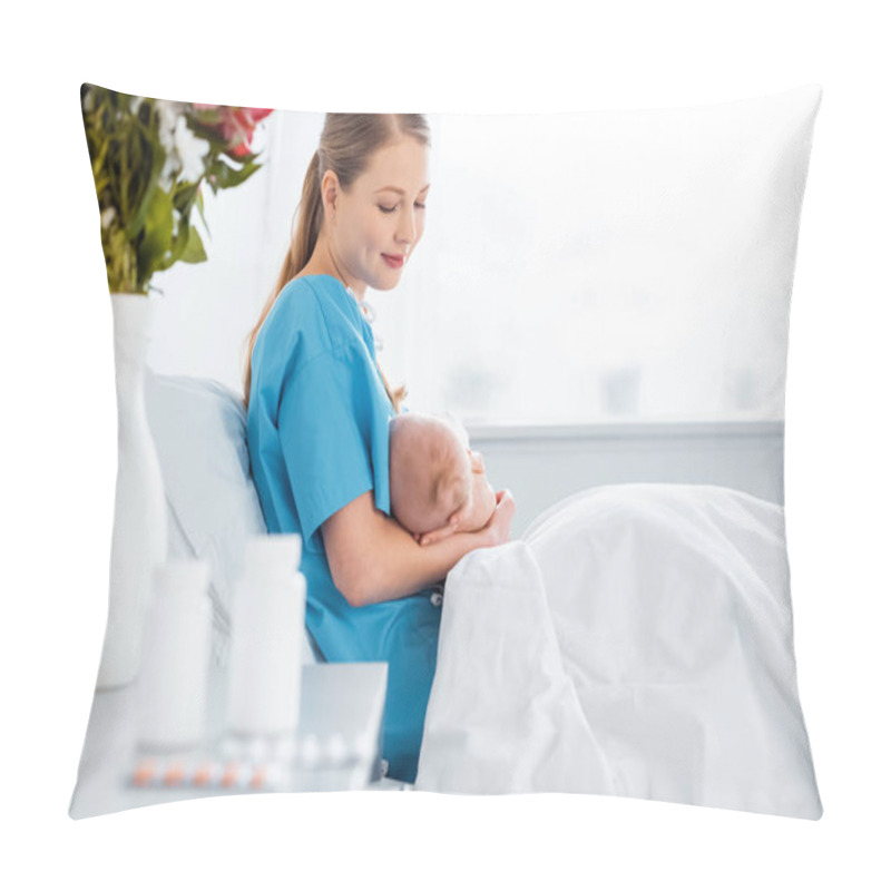 Personality  Side View Of Happy Young Mother Sitting On Bed And Breastfeeding Newborn Baby In Hospital Room Pillow Covers