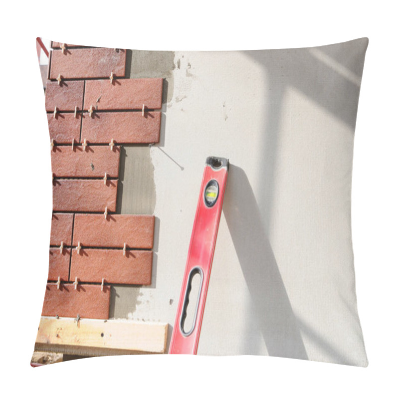 Personality  The Building Under Construction. Walls Under Construction Are Insulated And Plastered. Building Corner Lined Decorative Tiles. Spirit Level Pillow Covers