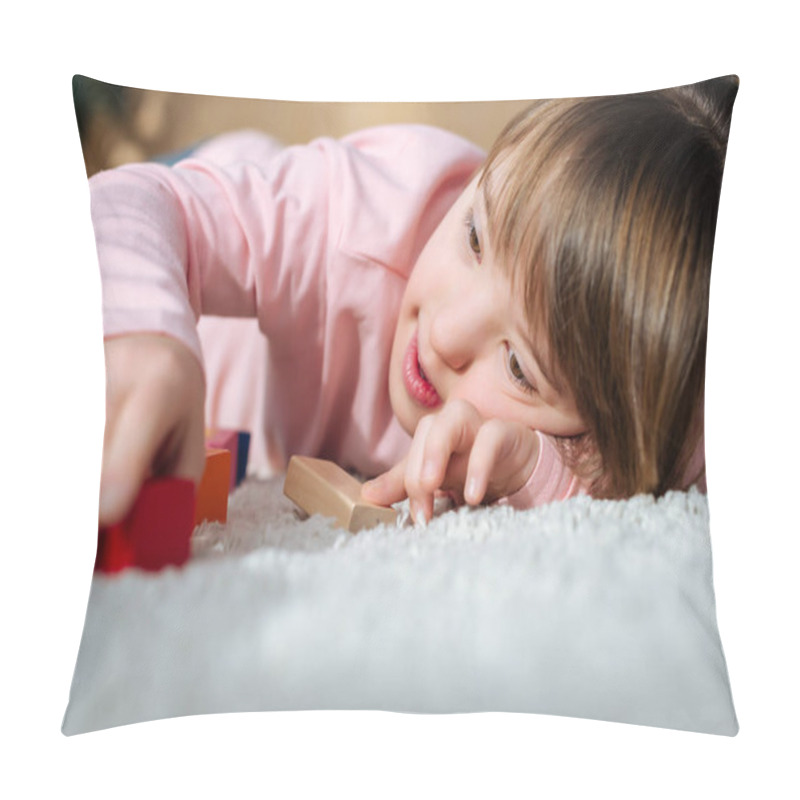 Personality  Kid With Down Syndrome Playing With Toy Cubes While Lying On A Floor Pillow Covers