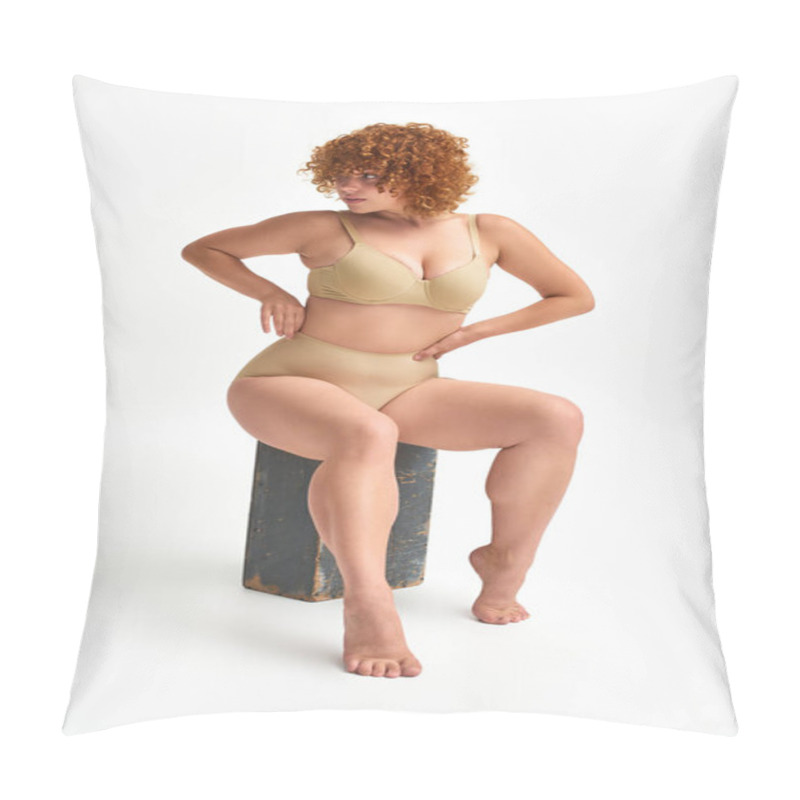 Personality  Redhead And Curvaceous Woman In Beige Lingerie Sitting On Wooden Box And Looking Away On White Pillow Covers