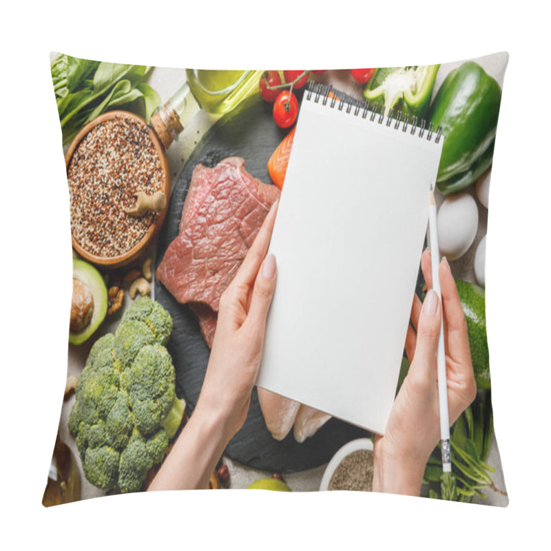 Personality  Cropped View Of Woman Holding Empty Notebook Above Food For Ketogenic Diet Menu Pillow Covers