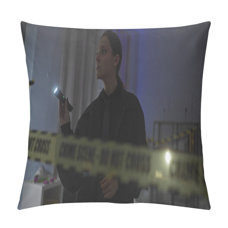 Personality  A Focused Woman Investigates A Dimly Lit Indoor Crime Scene With Caution Tape And Flashlight In Hand. Pillow Covers