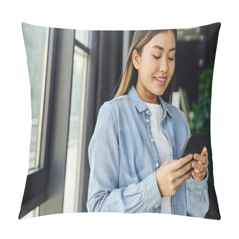 Personality  Happy And Trendy Asian Woman In Blue Denim Shirt, With Brunette Hair Standing In Modern Office, Smiling And Messaging On Mobile Phone, Successful Youth, Business Career Pillow Covers