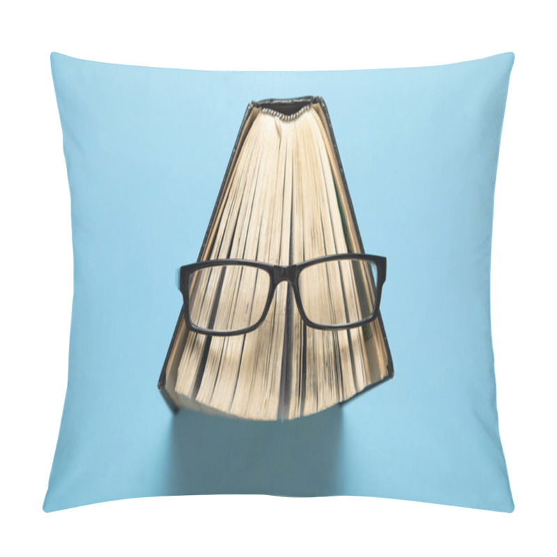 Personality  Eyeglasses And Book On The Blue Background. Pillow Covers