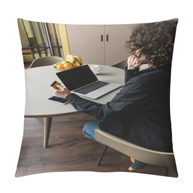 Personality  Back View Of Freelancer Holding Credit Card While Sitting At Laptop With Blank Screen, Smartphone And Fruits Pillow Covers