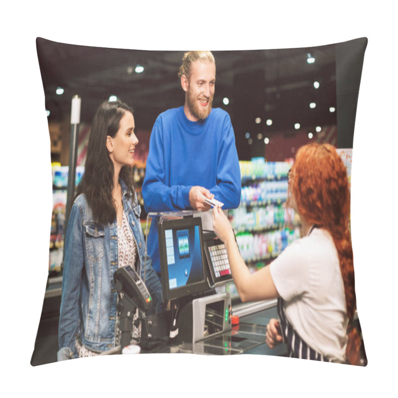 Personality  Young Cheerful Couple Standing Near Cashier Desk Happily Giving Credit Card To Teller In Modern Supermarket Pillow Covers