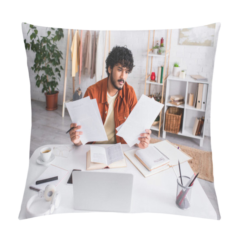 Personality  Indian Copywriter Holding Papers Near Devices And Notebooks On Table At Home  Pillow Covers