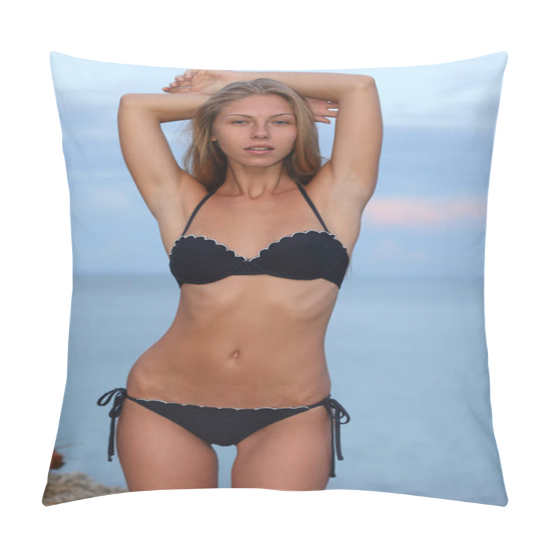 Personality  Gorgeous Young Blonde Adult Girl With Her Slender Tanned Body Is Standing On A Rocky Seashore Against The Evening Light Blue Water And Posing In Her Dark Bikini. Pillow Covers