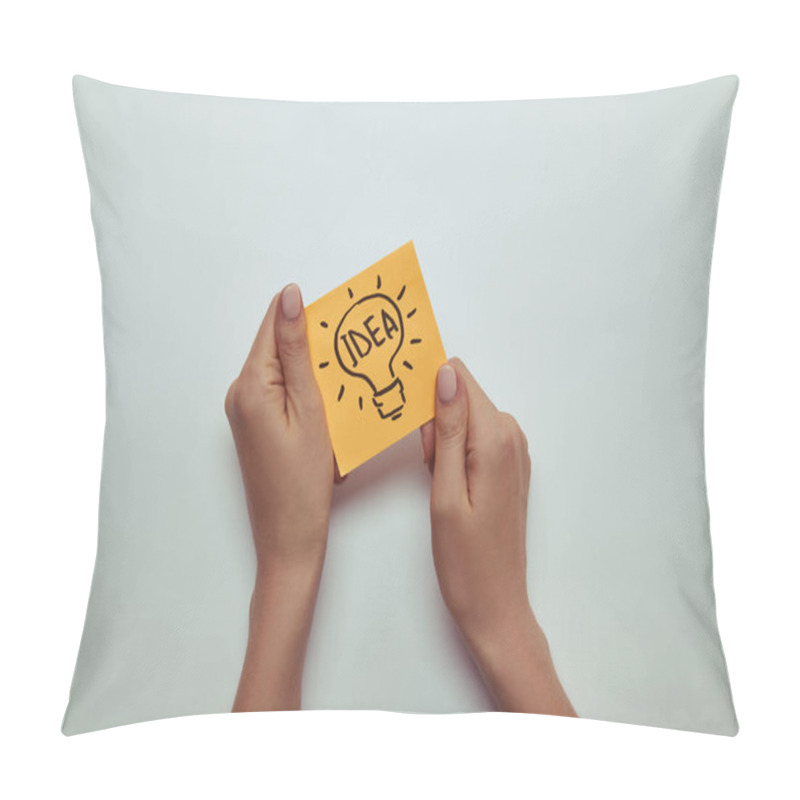 Personality  Cropped Image Of Woman Holding Paper Sticker With Word Idea In Lightbulb Pillow Covers