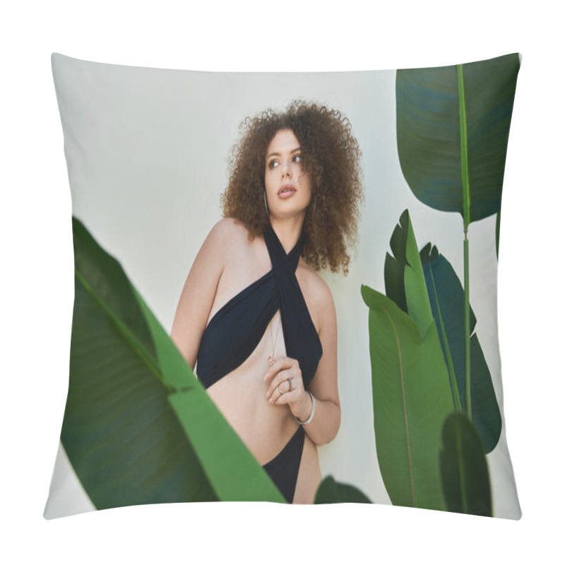 Personality  A Beautiful Woman With Curly Hair Poses In A Black Swimsuit Against A White Wall, Framed By Lush Green Foliage. Pillow Covers