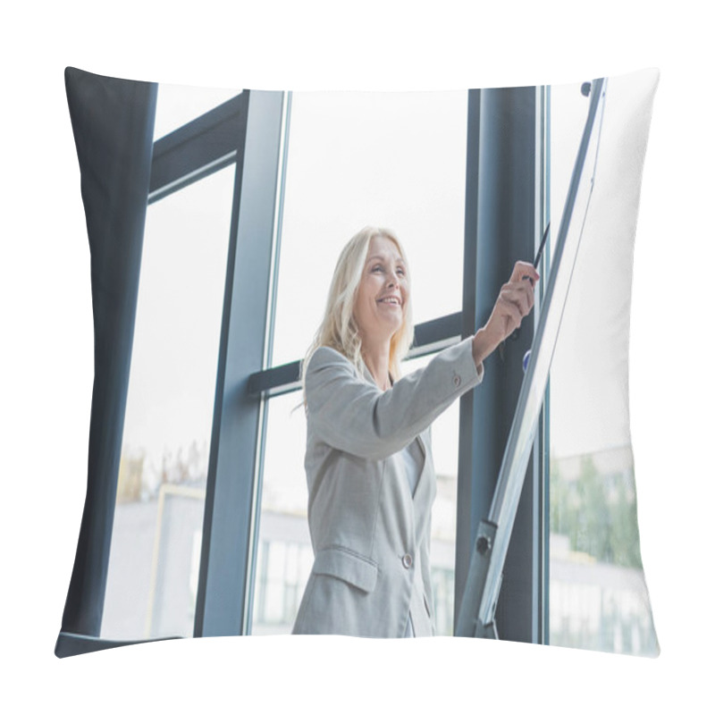 Personality  Attractive Mature Businesswoman Standing Near Window And Pointing With Pen At Flipchart During Business Meeting  Pillow Covers