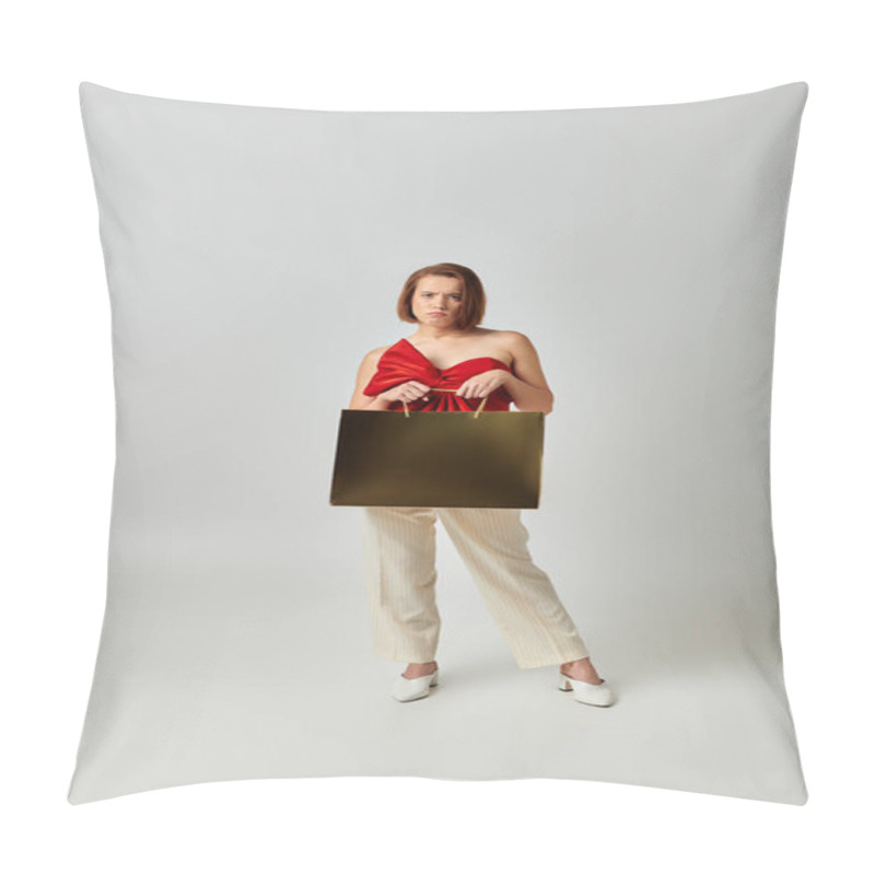 Personality  Holiday Shopping, Concerned Woman In Trendy Attire Holding Golden Shopping Bag On Grey Background Pillow Covers