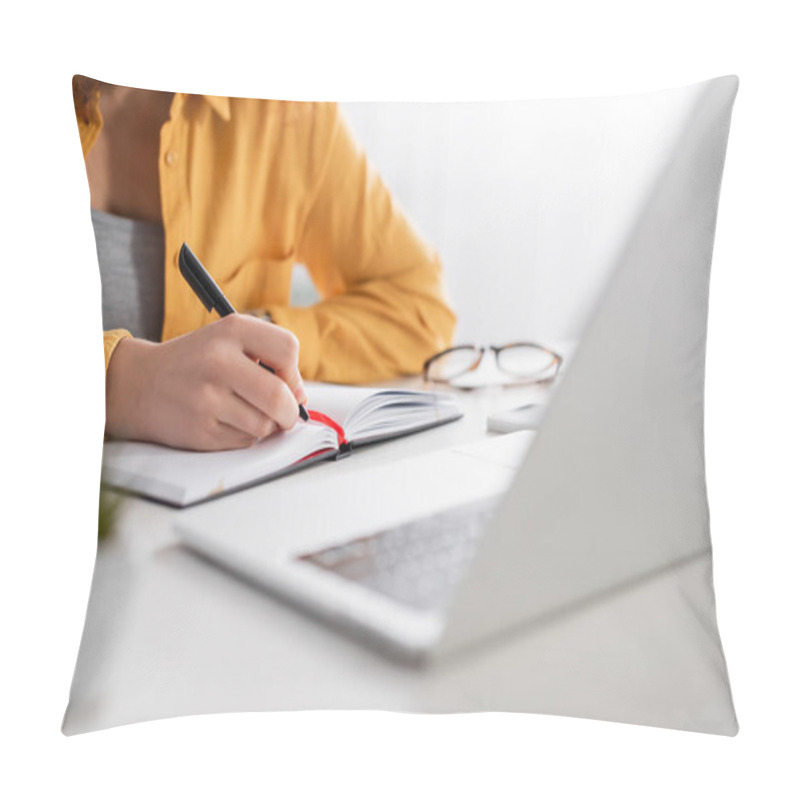 Personality  Cropped View Of Freelancer Writing In Notebook Near Laptop On Blurred Foreground Pillow Covers