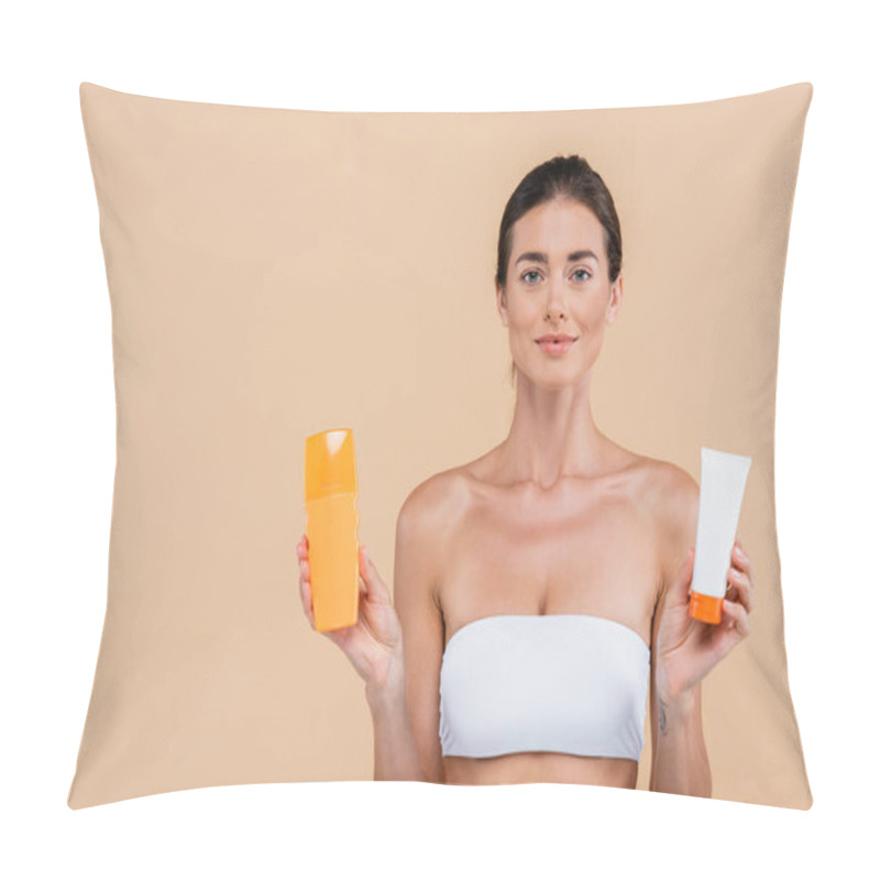 Personality  Charming Woman In Strapless Top Holding Tube And Bottle Of Sunscreen Isolated On Beige Pillow Covers