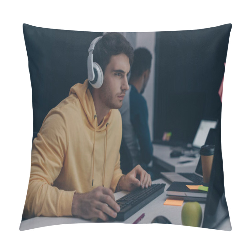 Personality  Selective Focus Of Programmer In Headphones Working Near African American Colleague At Night In Office Pillow Covers