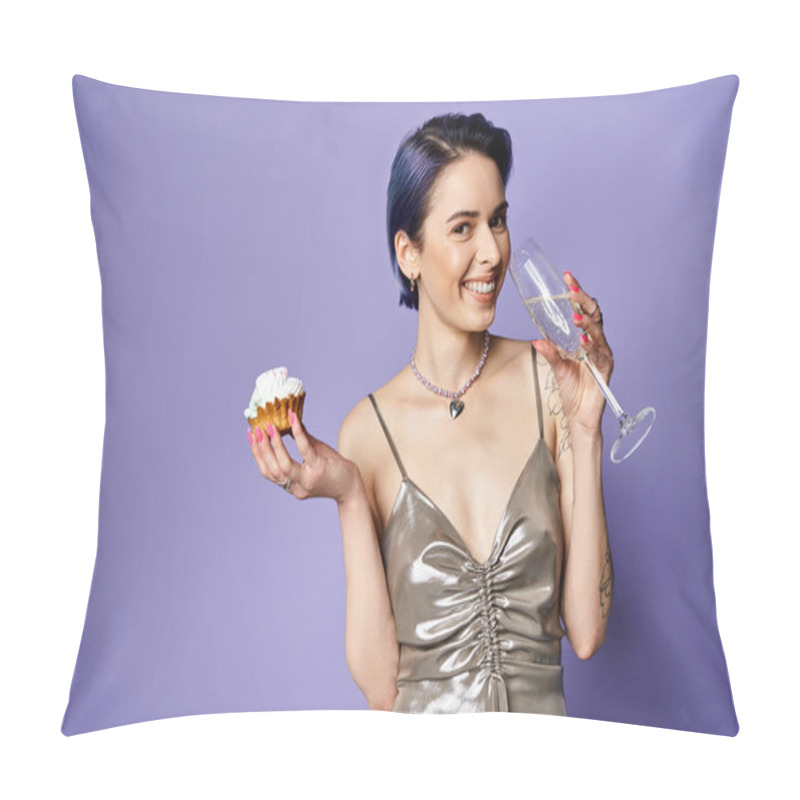 Personality  A stylish young woman with short blue hair in a silver dress holds a cupcake and a wine glass in a posed studio shot. pillow covers