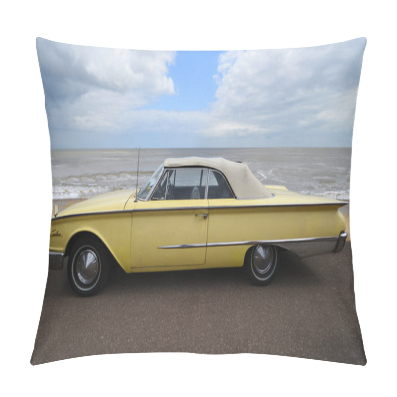 Personality  FELIXSTOWE, SUFFOLK, ENGLAND -  MAY 07, 2017:  Classic  Yellow Ford Sunliner Convertible Car Parked On Seafront Promenade Sea And Beach In Background. Pillow Covers