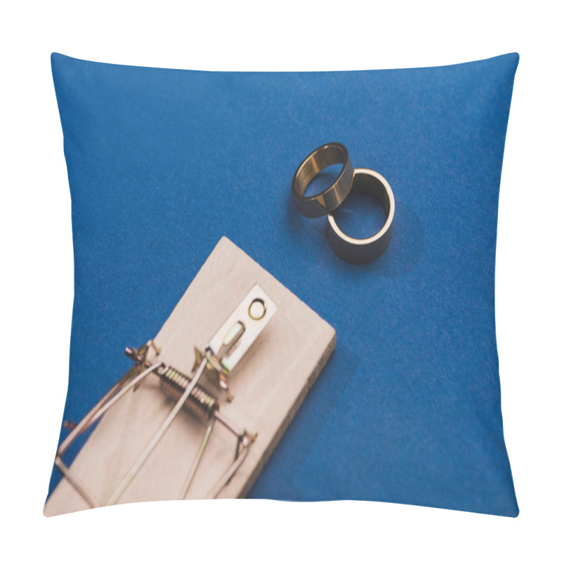 Personality  Selective Focus Of Two Golden Rings With Mouse Trap On Blue Background Pillow Covers