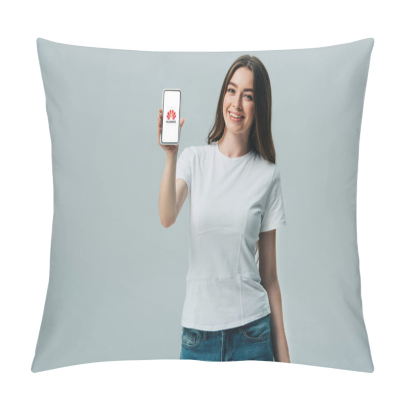 Personality  KYIV, UKRAINE - JUNE 6, 2019: Happy Beautiful Girl In White T-shirt Showing Smartphone With Huawei Logo Isolated On Grey Pillow Covers