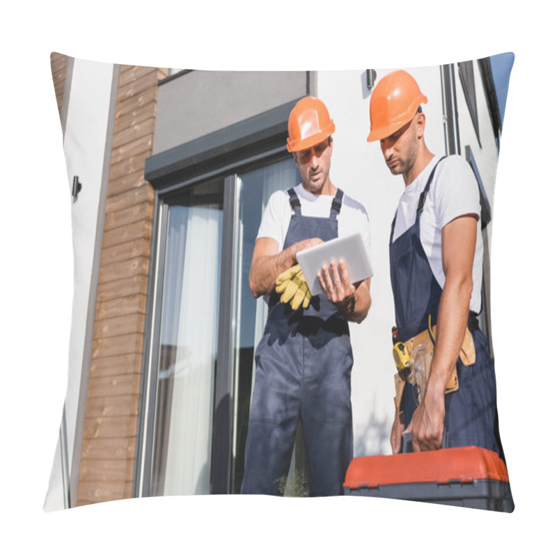 Personality  Selective Focus Of Builders In Overalls Using Digital Tablet While Working Near Building Pillow Covers