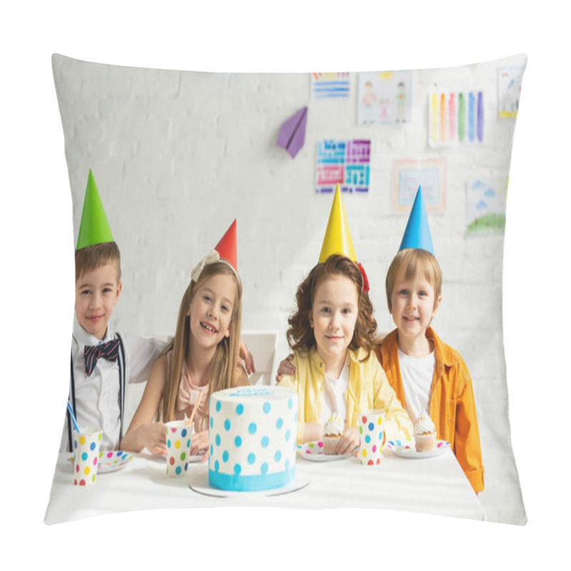 Personality  Happy Kids In Party Hats Sitting At Table With Cake And Looking At Camera While Celebrating Birthday Together Pillow Covers