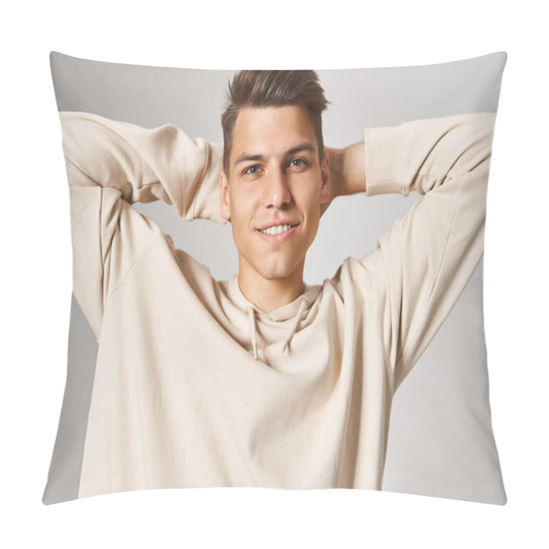 Personality  Charismatic Man In White Hoodie Smiling And Putting Hands Behind Head Against Light Background Pillow Covers