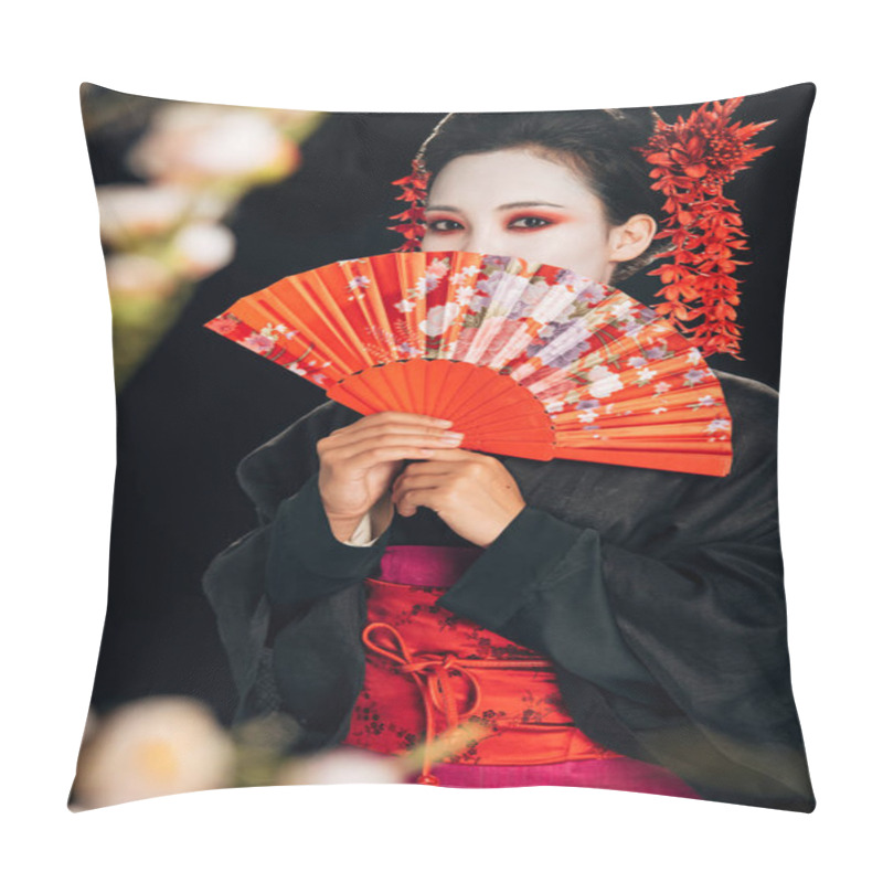 Personality  Selective Focus Of Beautiful Geisha In Black Kimono With Red Flowers In Hair Holding Hand Fan And Sakura Branches Isolated On Black Pillow Covers