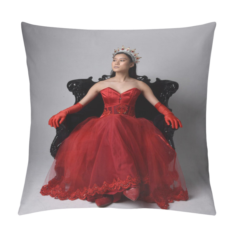 Personality  Full Length  Portrait Of Beautiful Young Asian Woman Wearing Red Corset, Long Opera Gloves And Ornate Gothic Queen Crown. Graceful Posing While Seated On Chair, Isolated On Studio Background. Pillow Covers