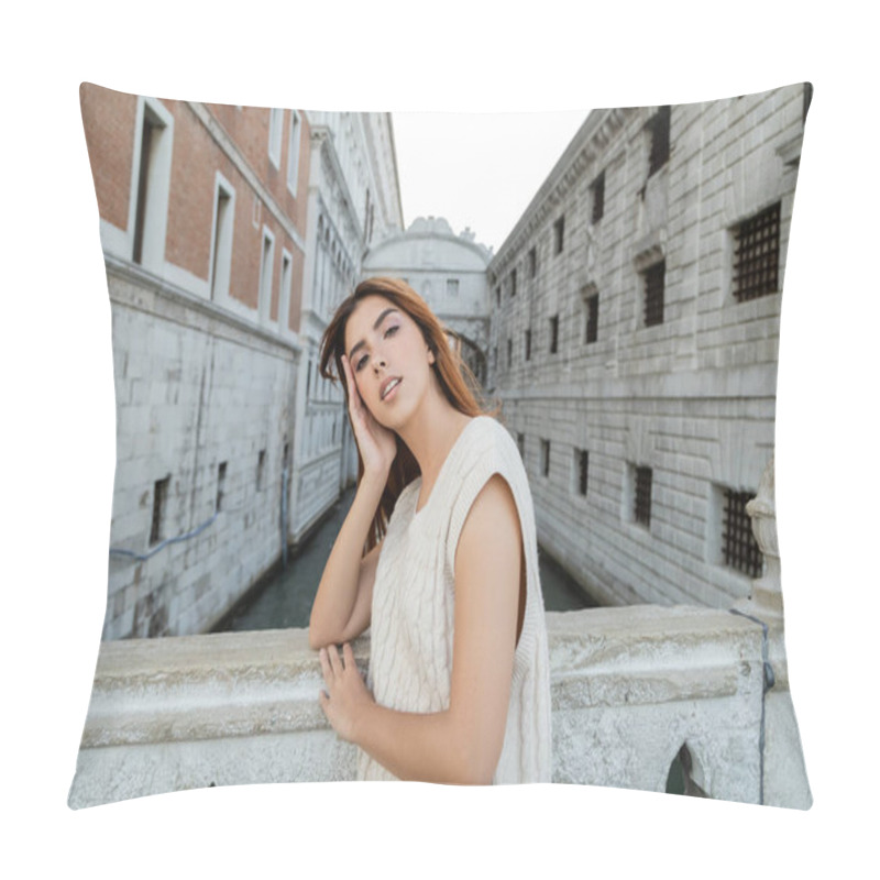 Personality  Young Woman With Hand Near Fence Looking At Camera Near Medieval Prison In Venice Pillow Covers