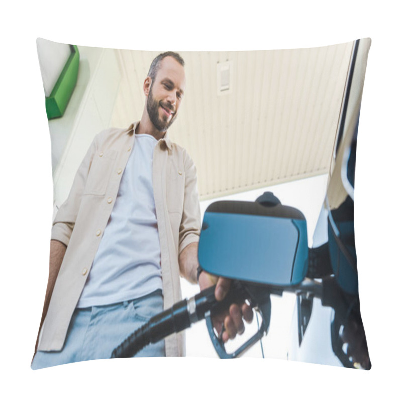 Personality  Low Angle View Of Happy Man Holding Fuel Pump While Refueling Automobile With Benzine At Gas Station Pillow Covers